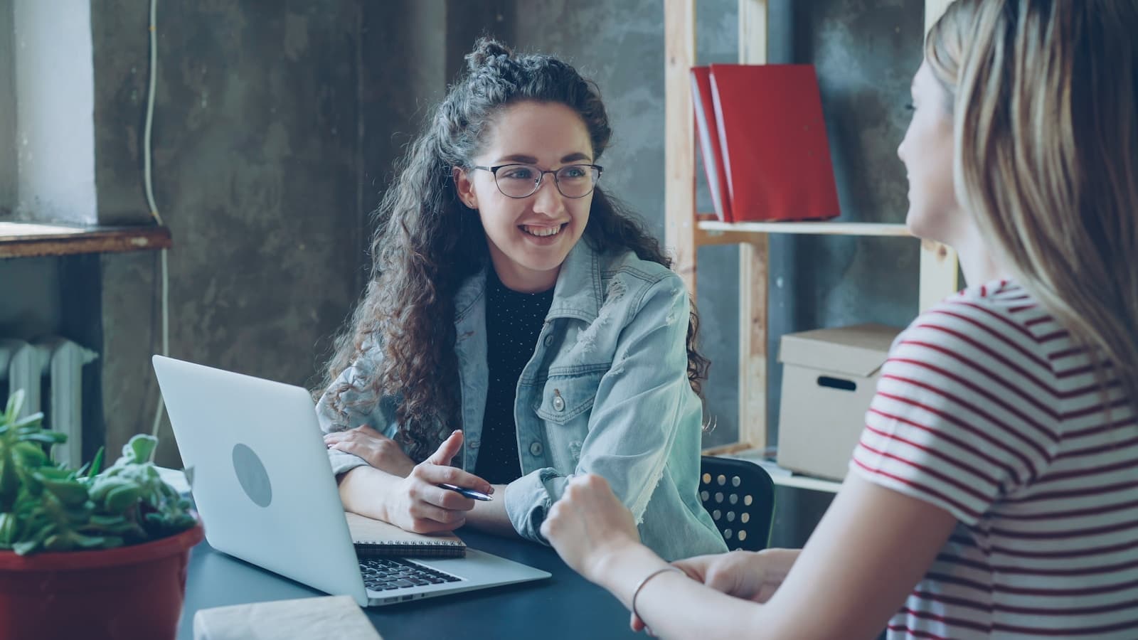 Two business professionals discussing a workflow together